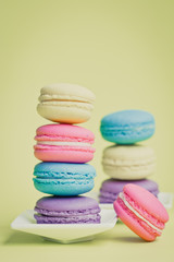 Sweet and colourful french macaroons on background