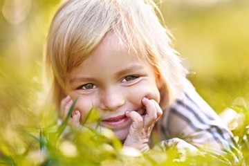 portrait of little girl outdoors in summer