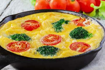 Frittata with broccoli and cherry tomatoes