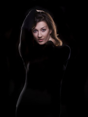 Fototapeta na wymiar beautiful young woman on a black background