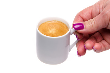 A woman's hand holding a cup of coffee