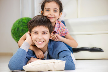 Happy brother and cute little sister