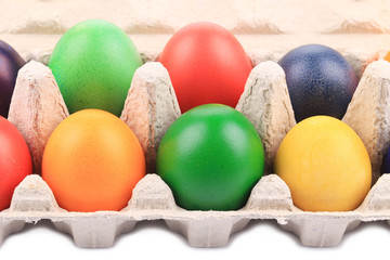 Colorful Easter Eggs in box.