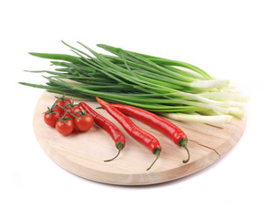 Vegetables on wooden platter.