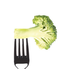 Fresh broccoli on a fork.