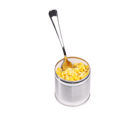 Canned corn in an opened can with spoon.