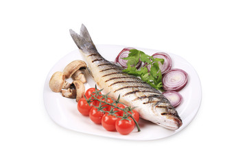 Grilled seabass on plate with tomatoes.