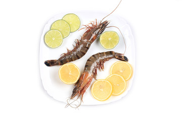 Raw tiger shrimps on plate.