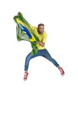young attractive brazil supporter jumping with Brazil flag