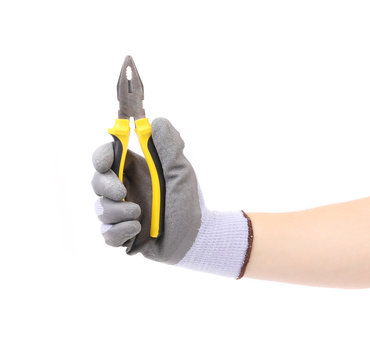 Hand in gloves holding pliers.