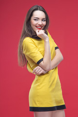 Woman half length on red background