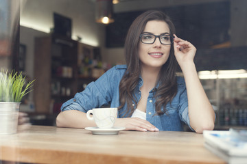 Portrait of beautiful woman at cafe
