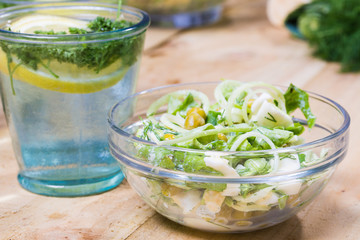 lemonade with parsley and bowl of vegetarian salad
