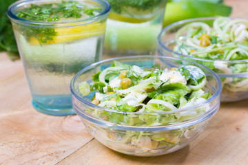 lemonade with parsley and bowl of vegetarian salad