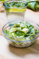 lemonade with parsley and bowl of vegetarian salad