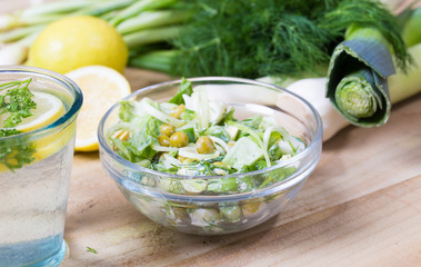 lemonade with parsley and bowl of vegetarian salad