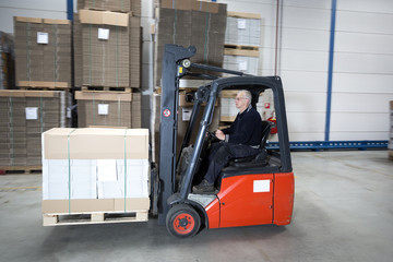 Forklift driving with a palet © corepics