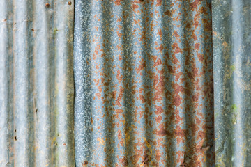 Rusty and old zinc plate wall closeup for background