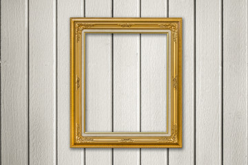 Gold photo frame on wooden background