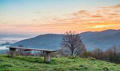 Sitting bench with sun rising