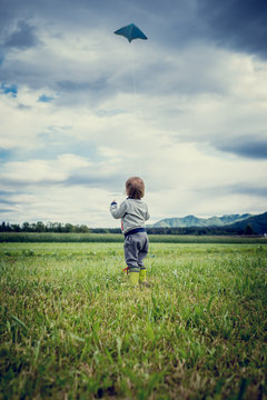 Young child flying a kite