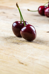 Two juicy healthy ripe red cherries