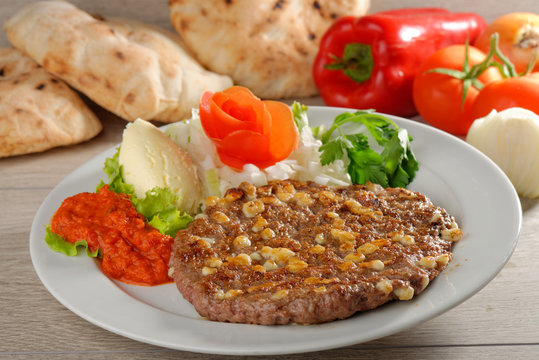 Presliced traditional burger patty called pljeskavica