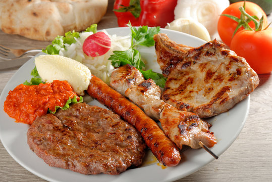 Mixed grill on a plate, Balkan food (selective focus)