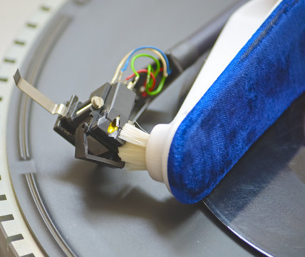 Close-up of a cleaning cartridge stylus turntable with brush