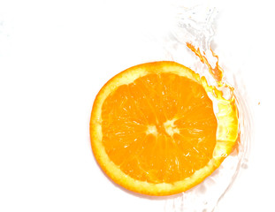 orange in water on white background