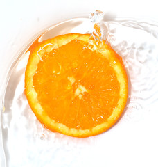 orange in water on white background