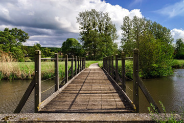 Obraz premium Wooden bridge over the river