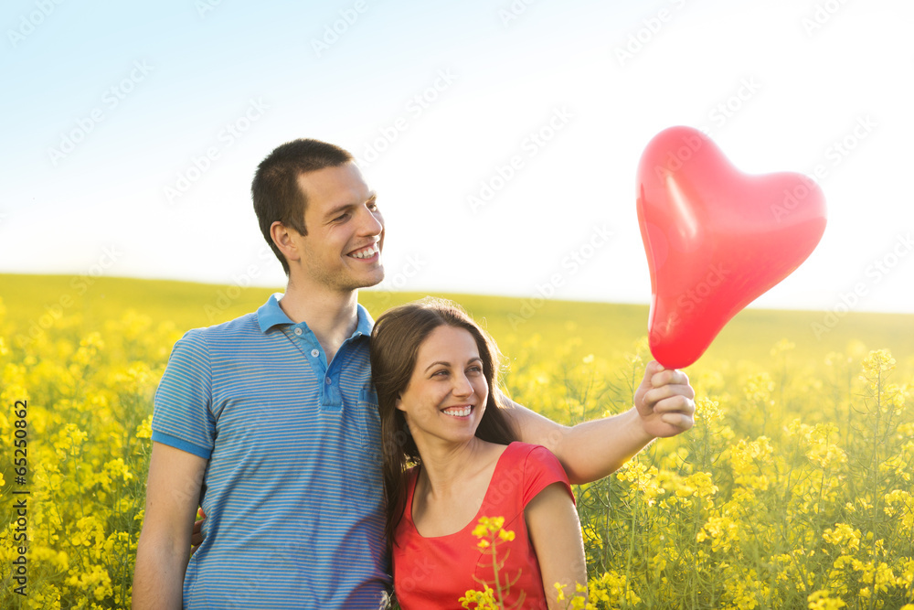 Wall mural couple in love in field