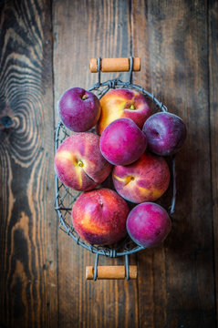 Peaches on wooden background