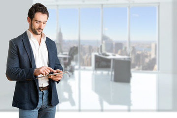 Casual Businessman Looking at a Tablet