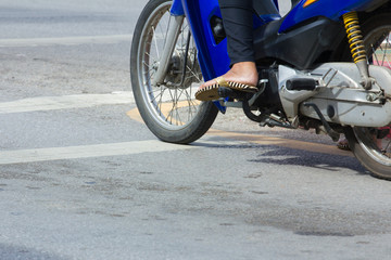 motorcycle stop at white line on junction waiting for traffic li