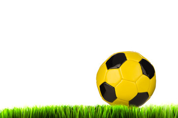 Fototapeta premium Yellow football on grass field