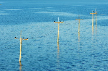 Flooded electricity pylons , thailand