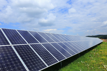 Solar Power Station on the spring flowering Meadow