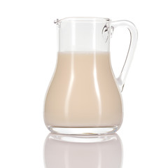Almond milk in jug on white background.