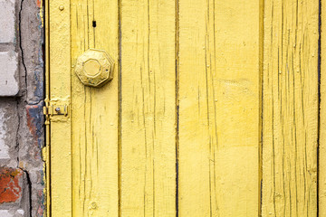 Fototapeta na wymiar Old weathered door with knob.