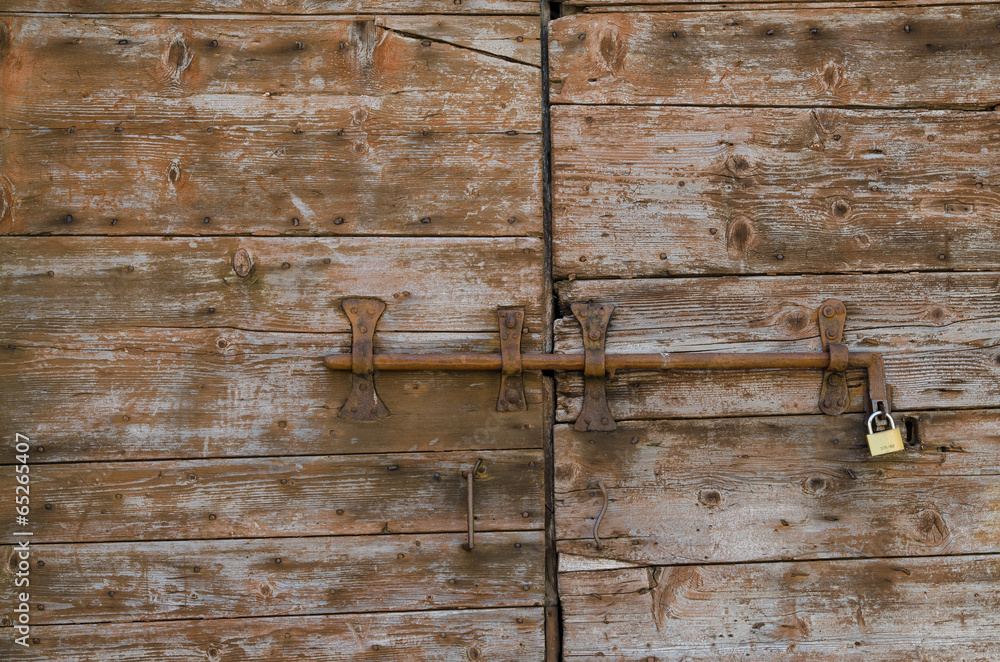 Wall mural old concept of security, wooden door with lock