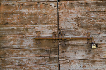 old concept of security, wooden door with lock