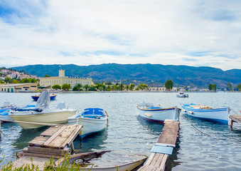 Wooden pier with fishing boats at Poros island in Greece
