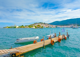 wooden pier with fishing boats at Poros island in Greece