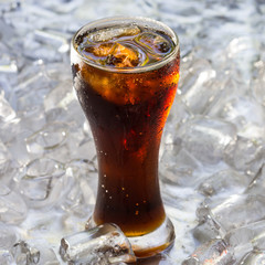 Glass of cola soda drink with ice cubes