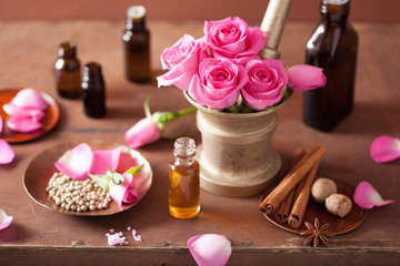 spa and aromatherapy set with rose flowers mortar and spices