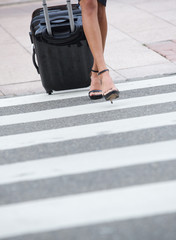Fototapeta premium Businesswoman crossing zebra crossing