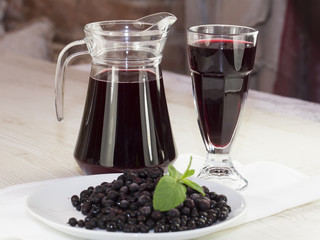 jar of berry drink on the wooden table