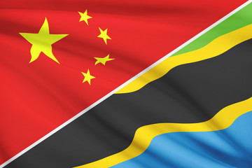Series of ruffled flags. China and United Republic of Tanzania.